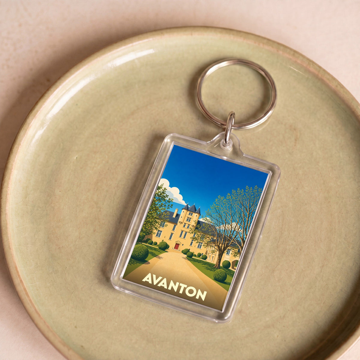 Porte-clés souvenir de la ville d'Avanton avec une illustration stylisée de son château.