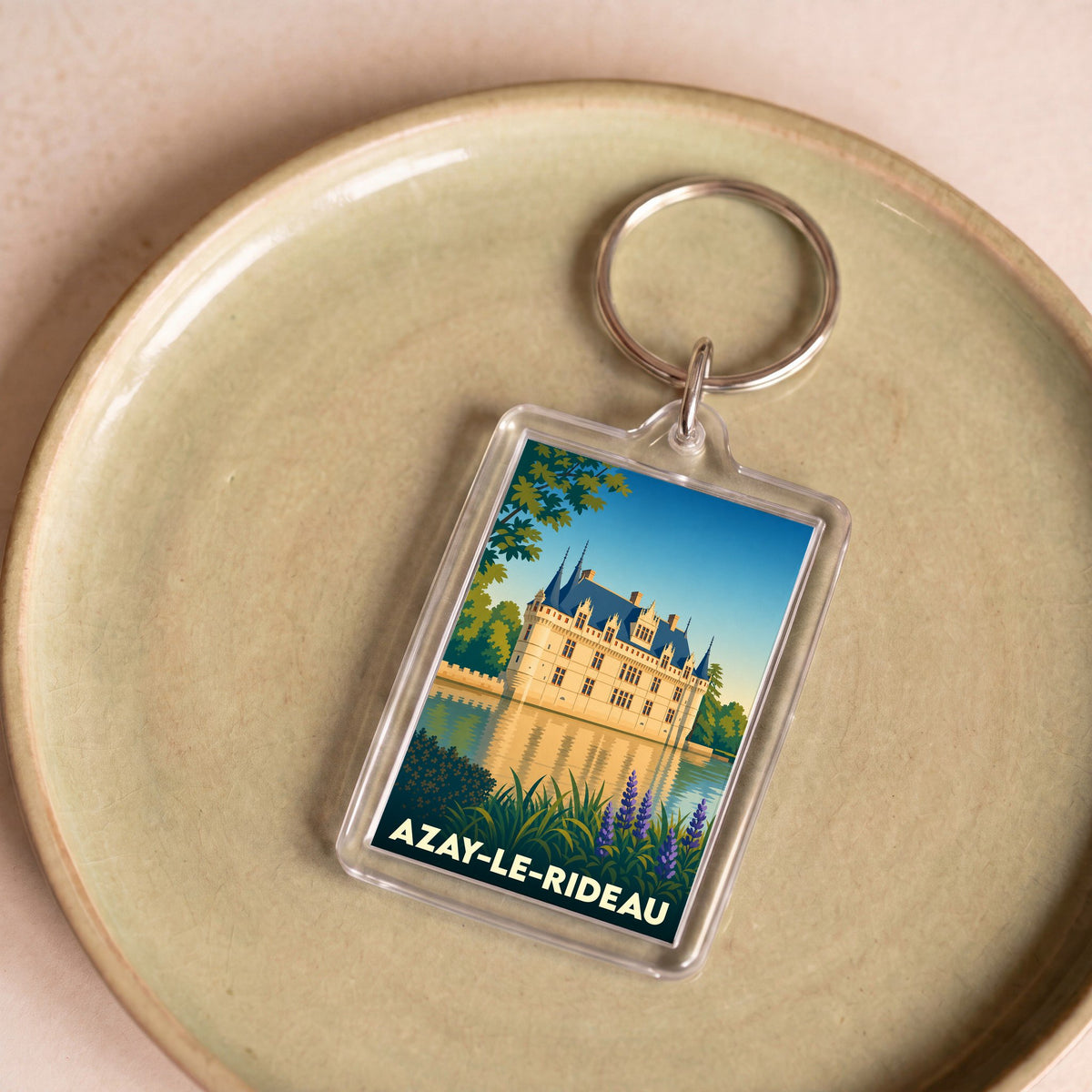 Porte-clés souvenir de la ville d'Azay-le-Rideau avec une illustration stylisée de son château.
