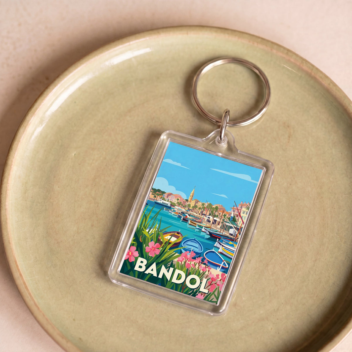 Porte-clés souvenir de la ville de Bandol avec une illustration stylisée.