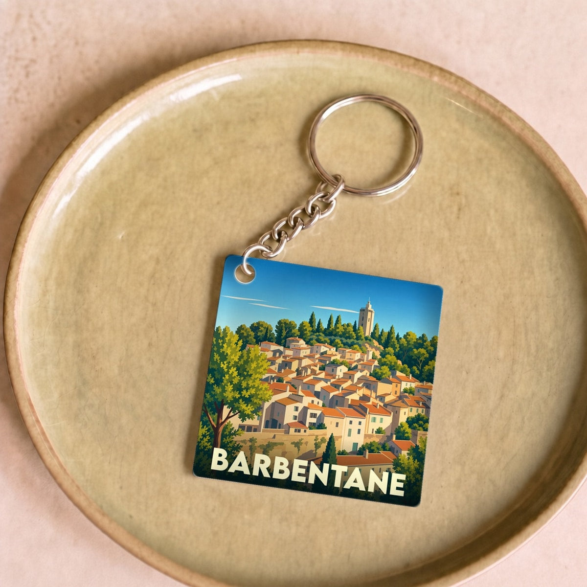 Porte-clés souvenir de la ville de Barbentane avec une illustration stylisée.