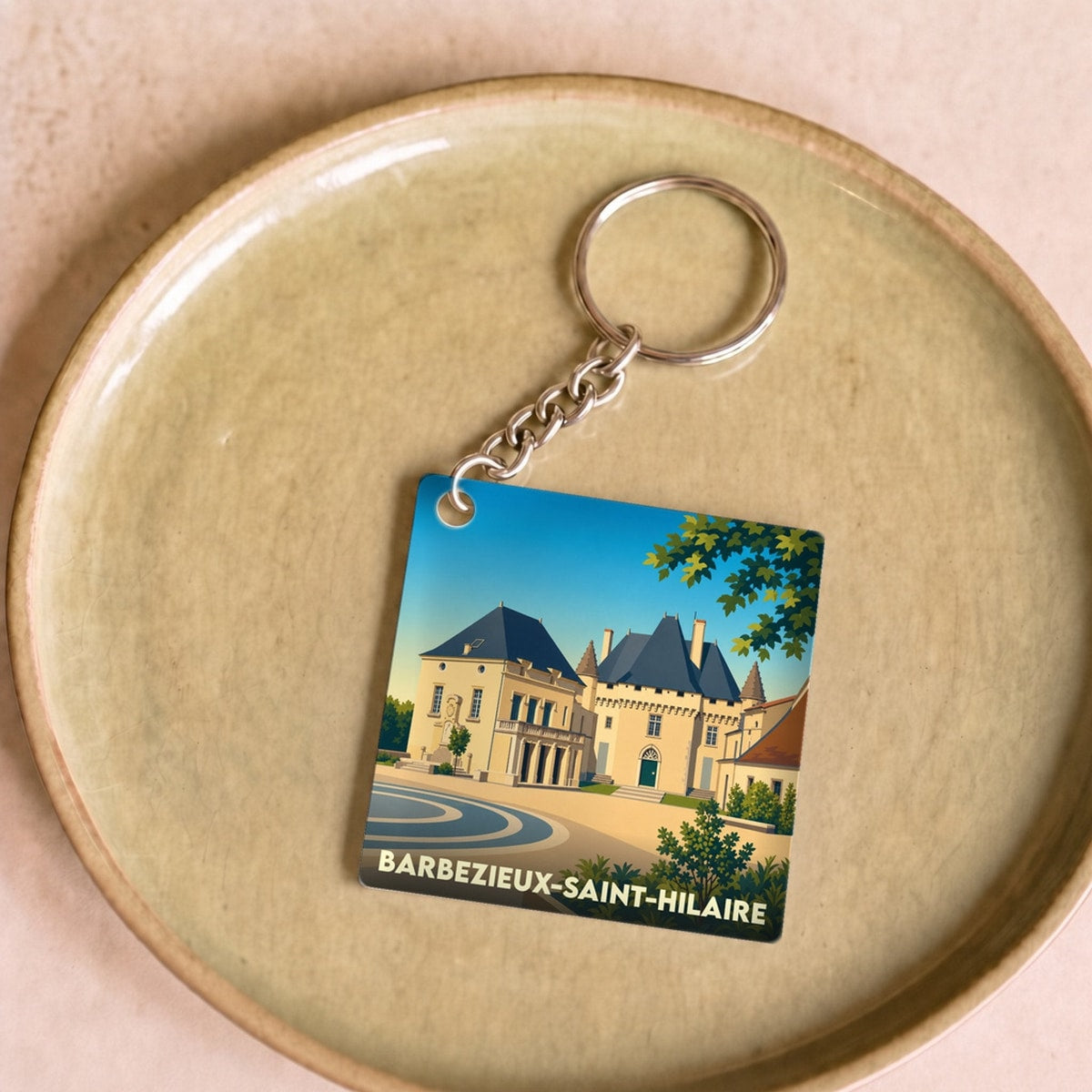 Porte-clés souvenir de la ville de Barbezieux-Saint-Hilaire avec une illustration stylisée de son château.