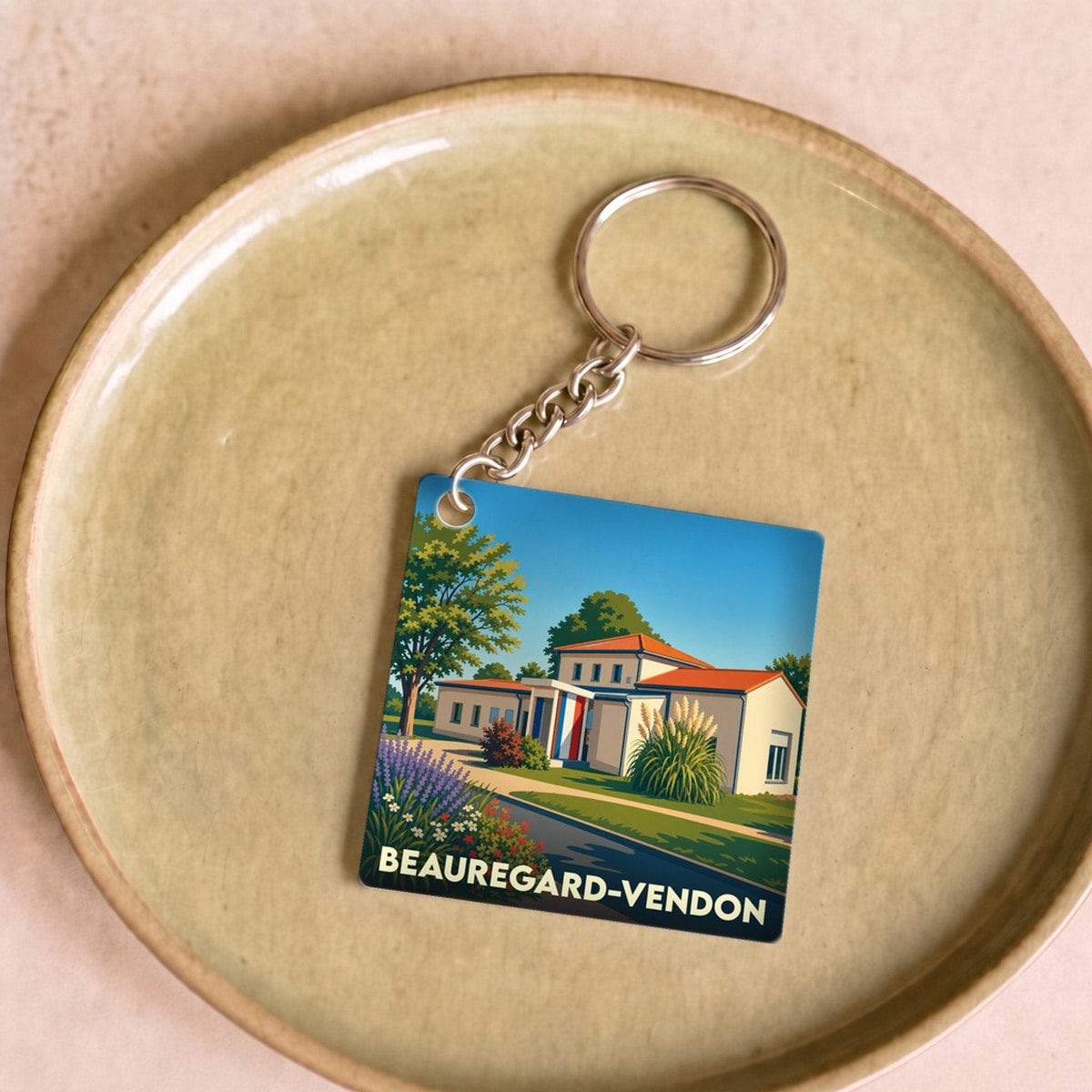 Porte-clés souvenir de la ville de Beauregard-Vendon avec une illustration stylisée.
