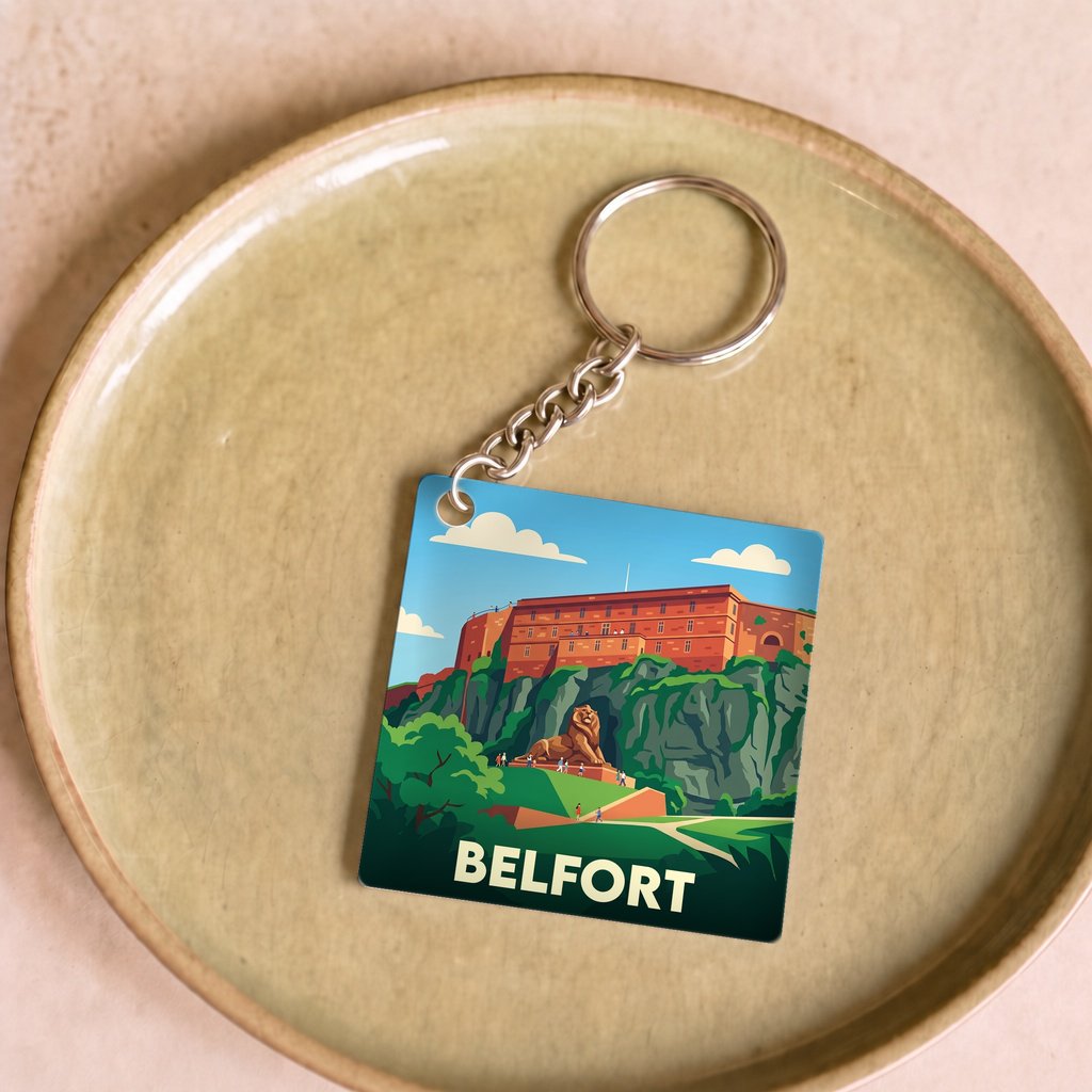 Porte-clés souvenir de la ville de Belfort avec une illustration stylisée.