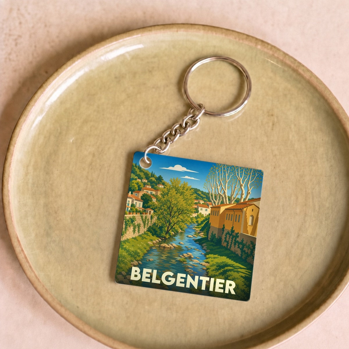 Porte-clés souvenir de la ville de Belgentier avec une illustration stylisée d'un cours d'eau.