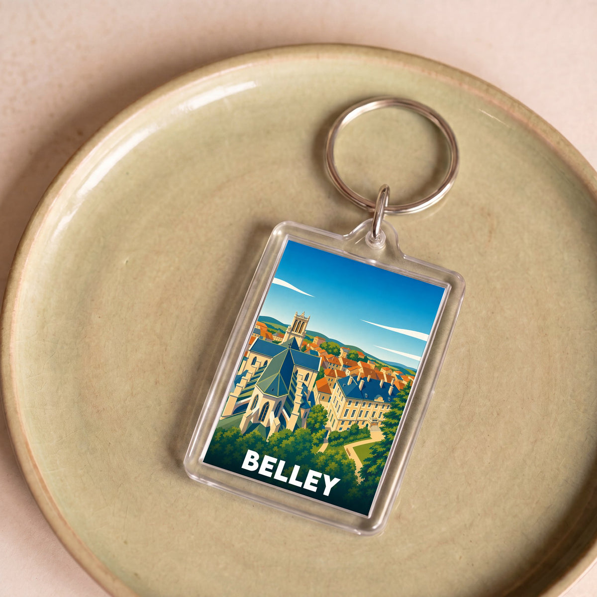 Porte-clés souvenir de la ville de Belley avec une illustration stylisée.