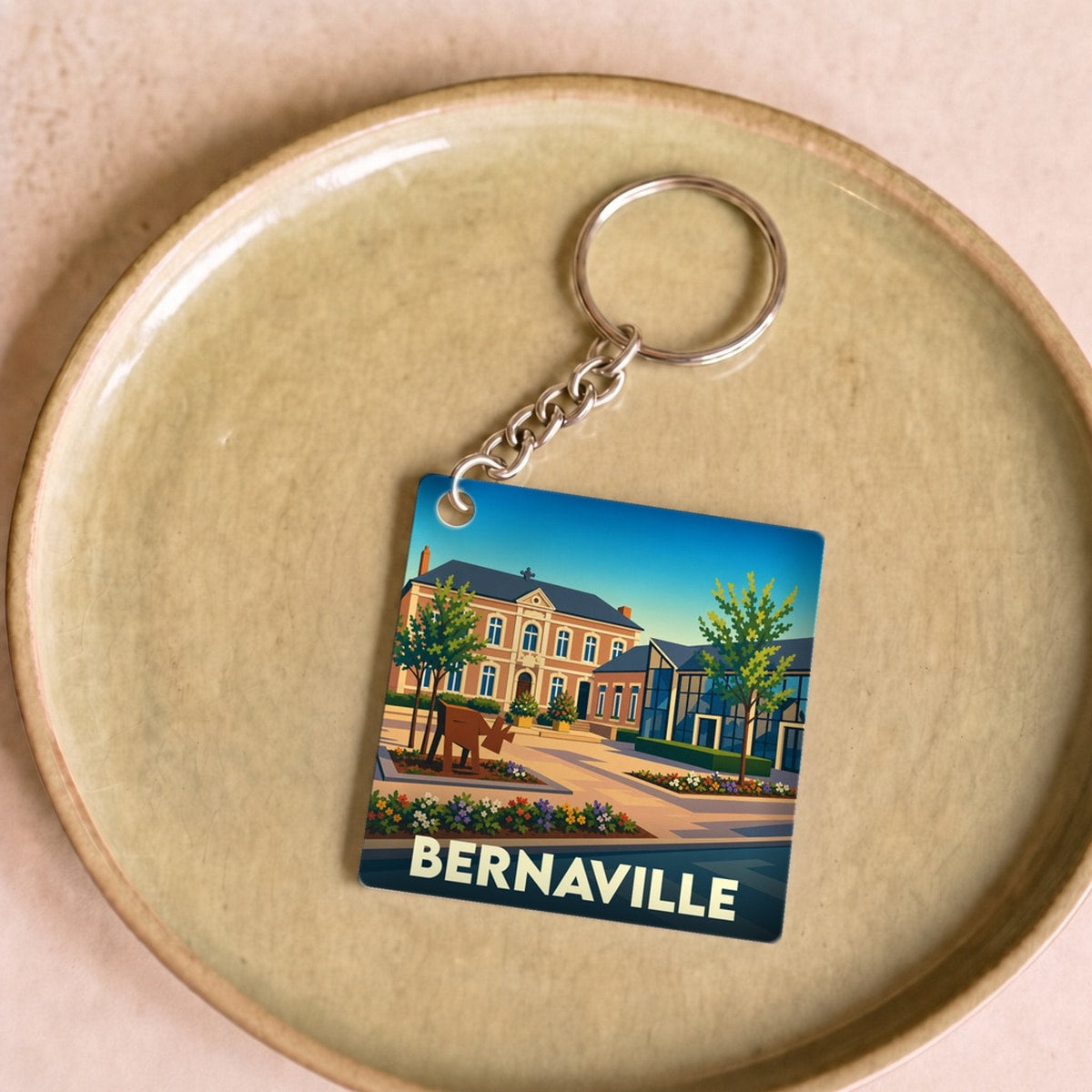 Porte-clés souvenir de la ville de Bernaville avec une illustration stylisée.