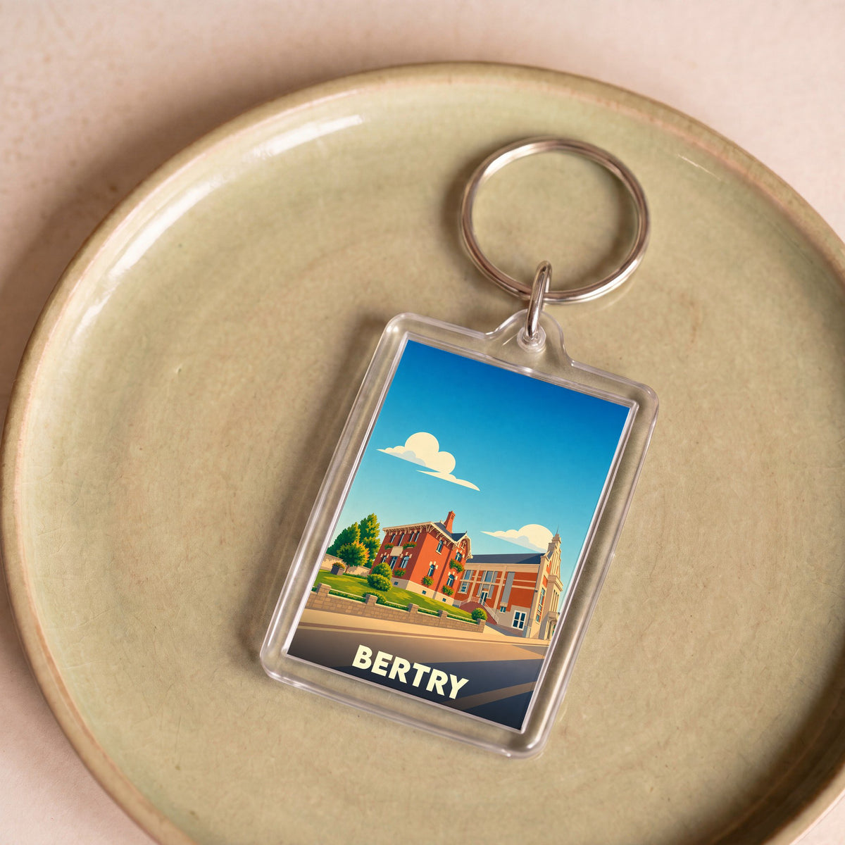 Porte-clés souvenir de la ville de Bertry avec une illustration stylisée.