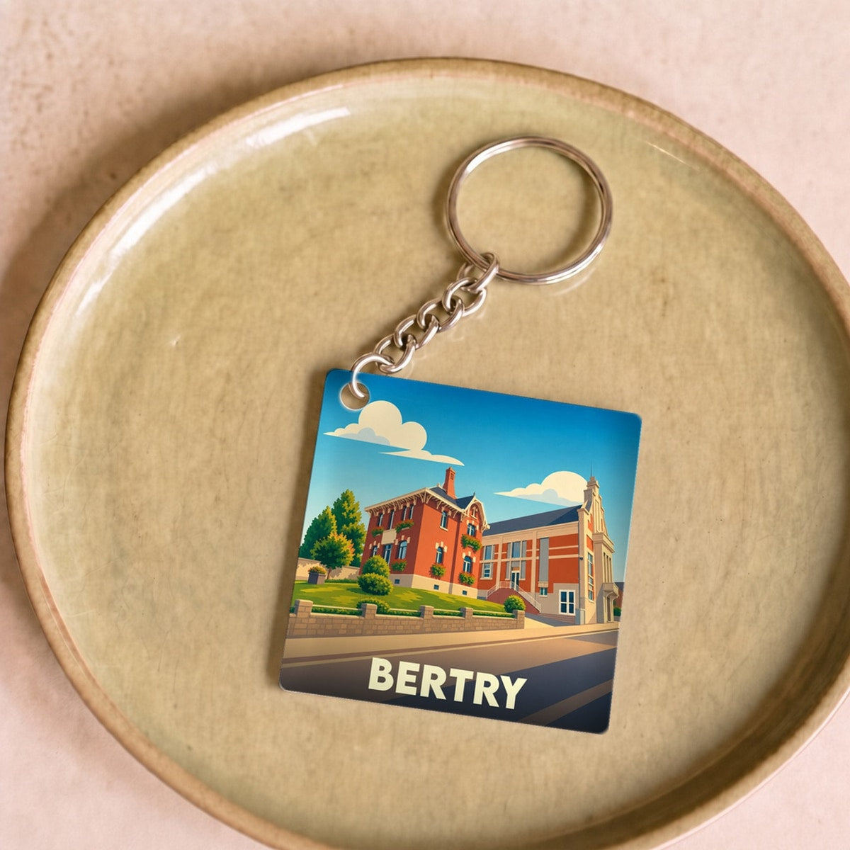 Porte-clés souvenir de la ville de Bertry avec une illustration stylisée.