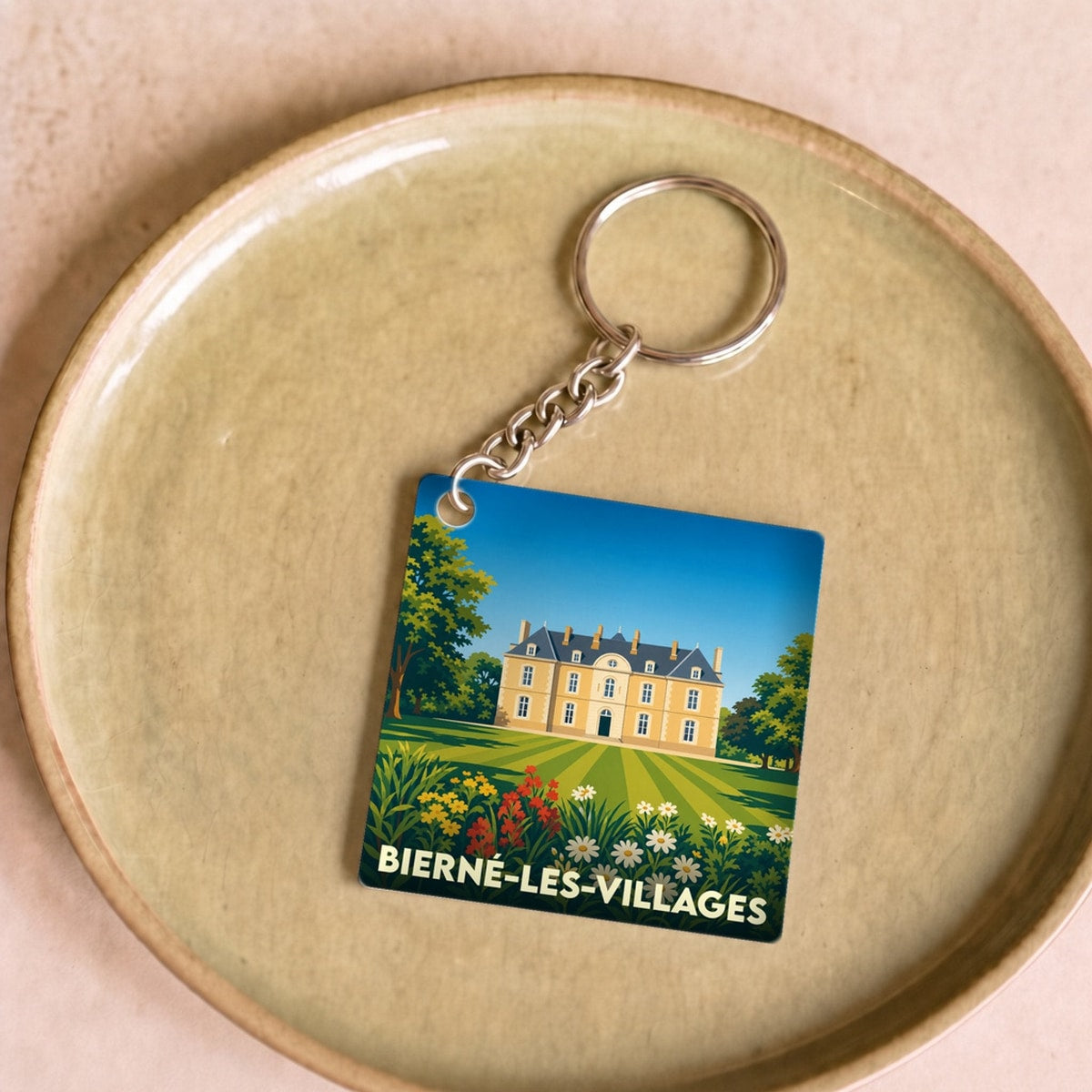 Porte-clés souvenir de la ville de Bierné-les-Villages avec une illustration stylisée.
