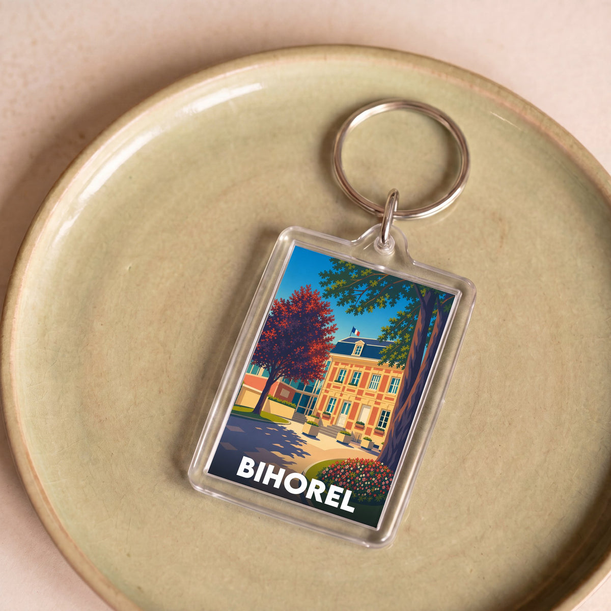 Porte-clés souvenir de la ville de Bihorel avec une illustration stylisée.