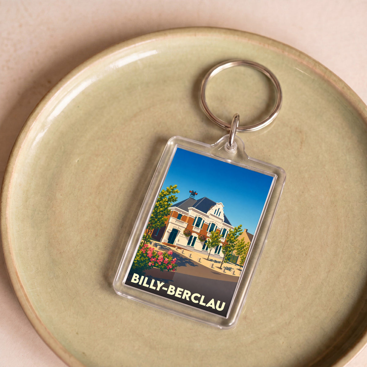 Porte-clés souvenir de la ville de Billy-Berclau avec une illustration stylisée de sa mairie.