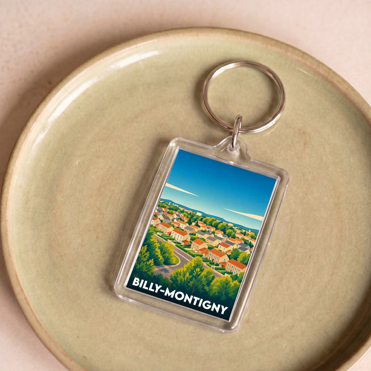 Porte-clés souvenir de la ville de Billy-Montigny avec une illustration stylisée.