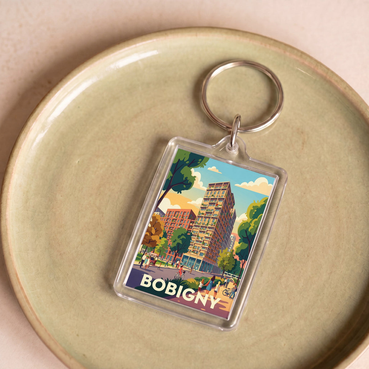 Porte-clés souvenir de la ville de Bobigny avec une illustration stylisée.