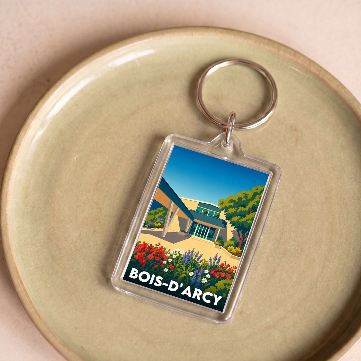 Porte-clés souvenir de la ville de Bois-d'Arcy avec une illustration colorée et stylisée.