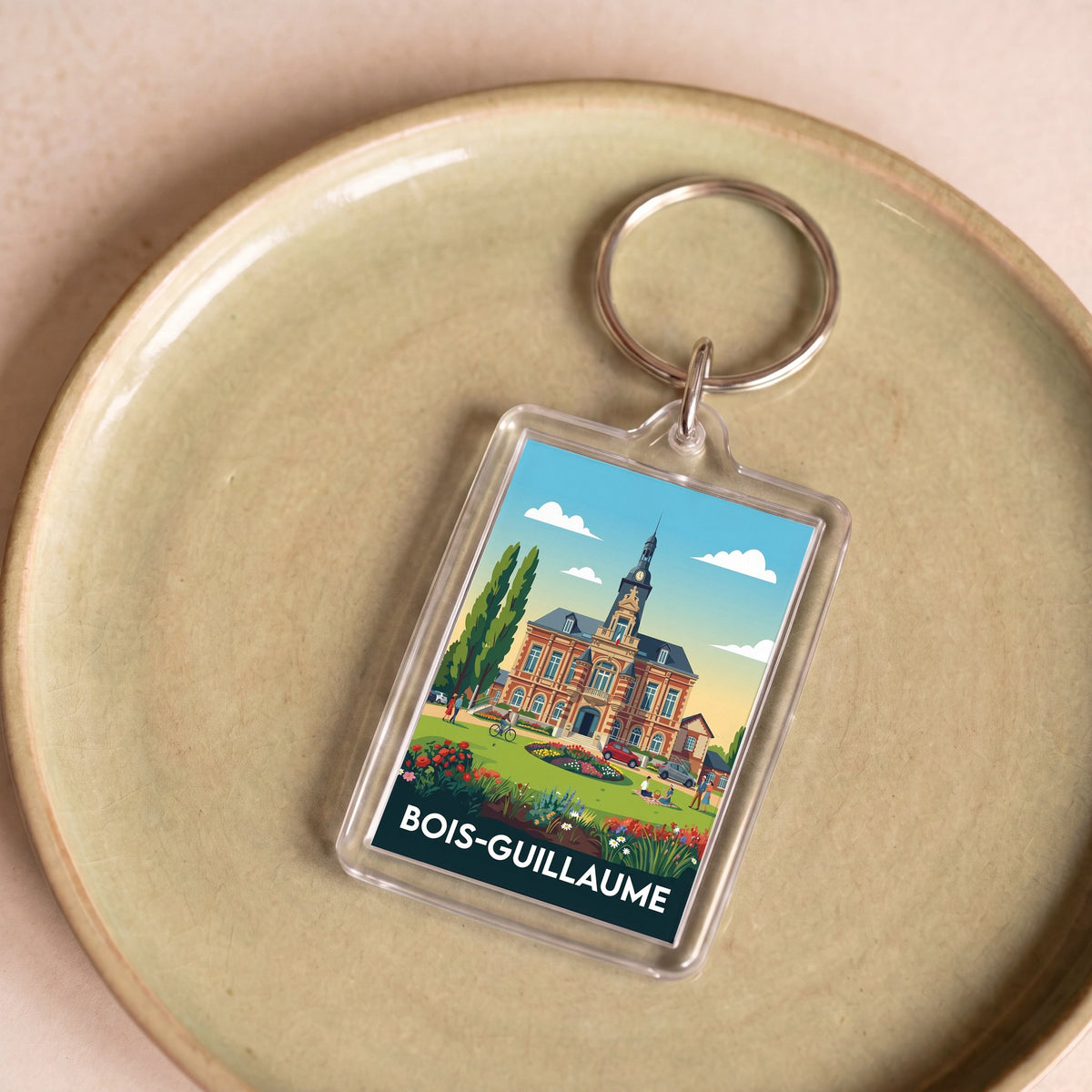 Porte-clés souvenir de la ville de Bois-Guillaume avec une illustration stylisée.