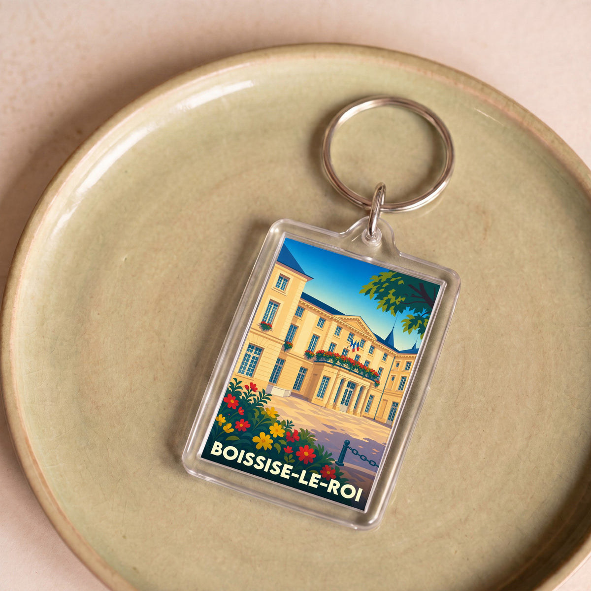 Porte-clés souvenir de la ville de Boissise-le-Roi avec une illustration stylisée.