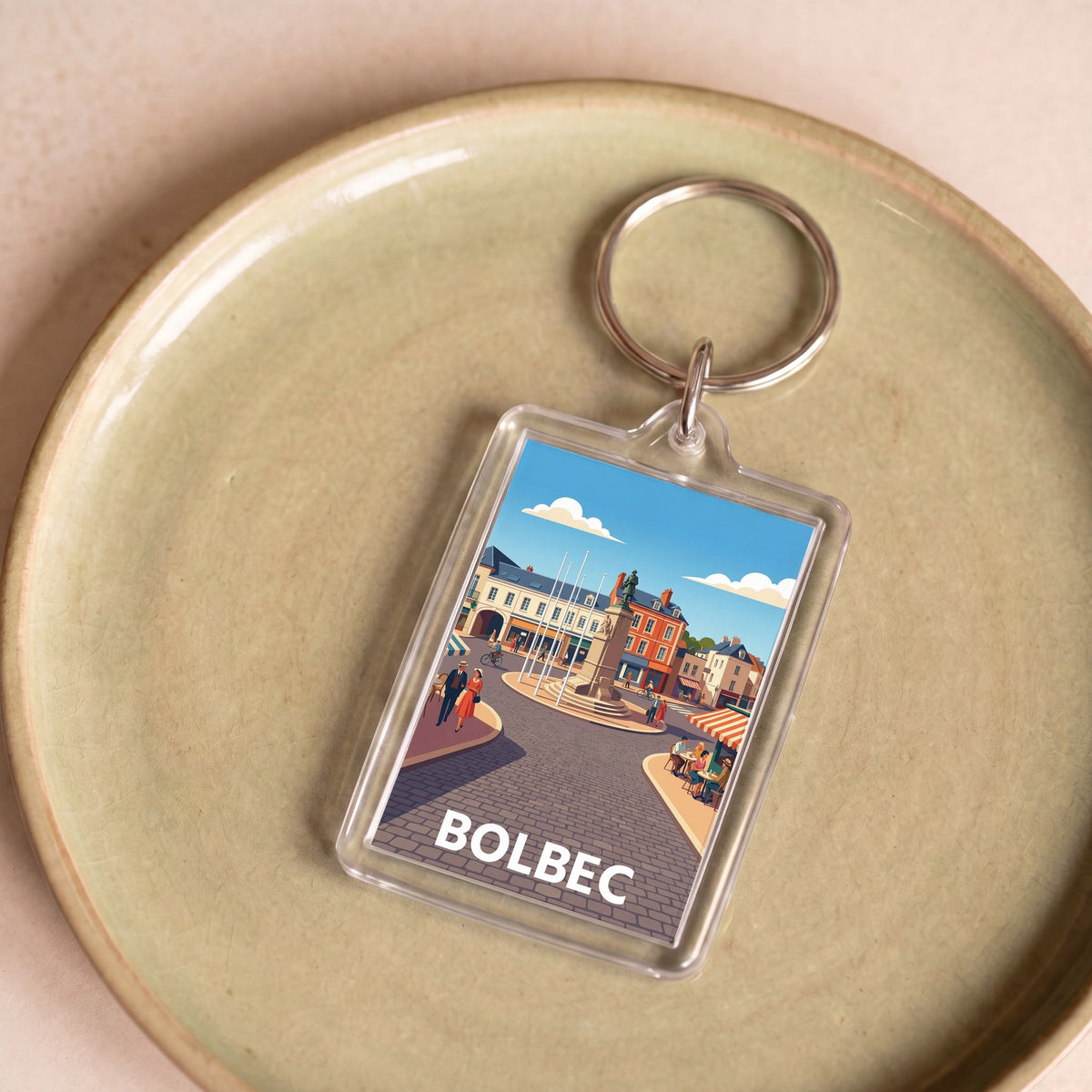 Porte-clés souvenir de la ville de Bolbec avec une illustration stylisée.