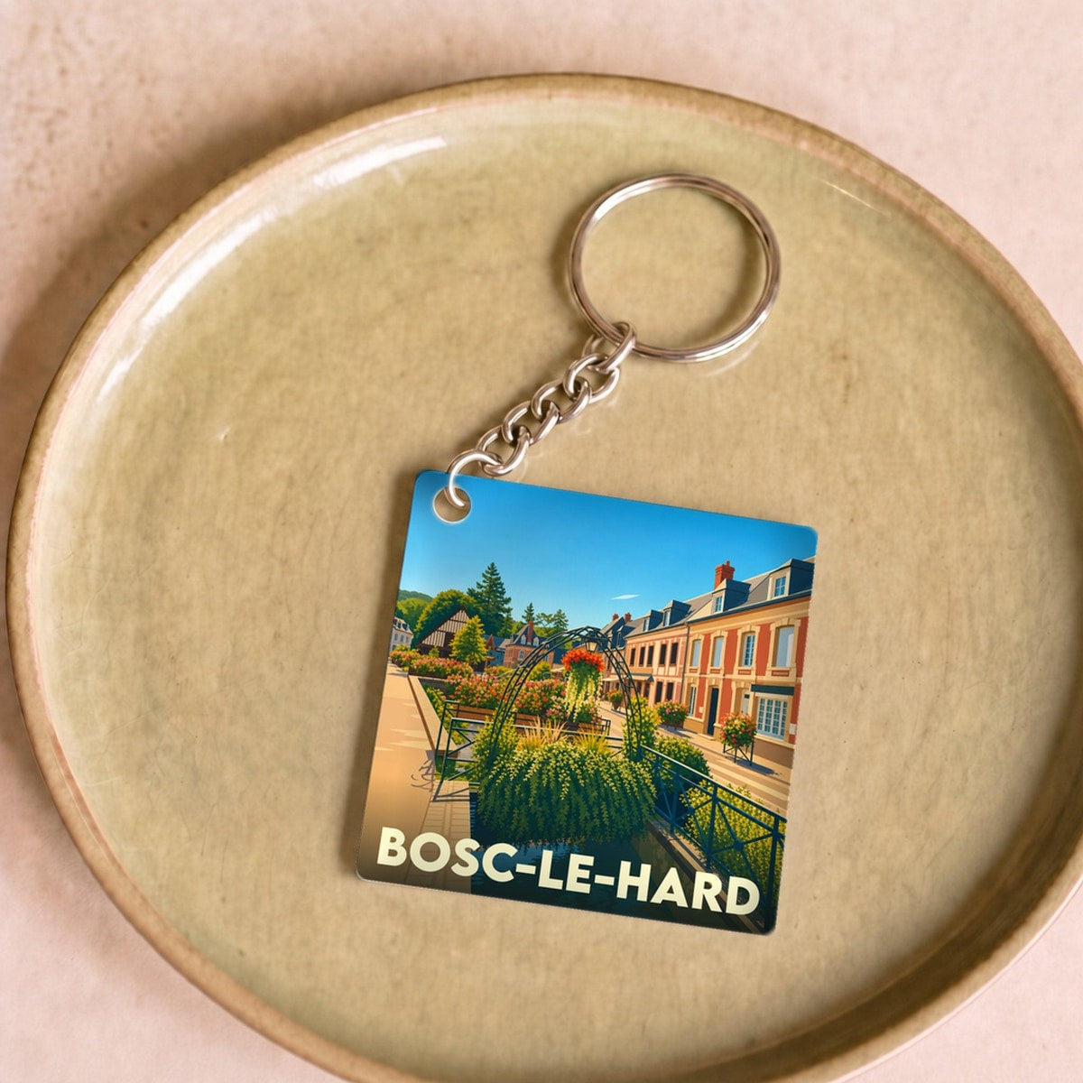 Porte-clés souvenir de la ville de Bosc-le-Hard avec une illustration colorée et stylisée.