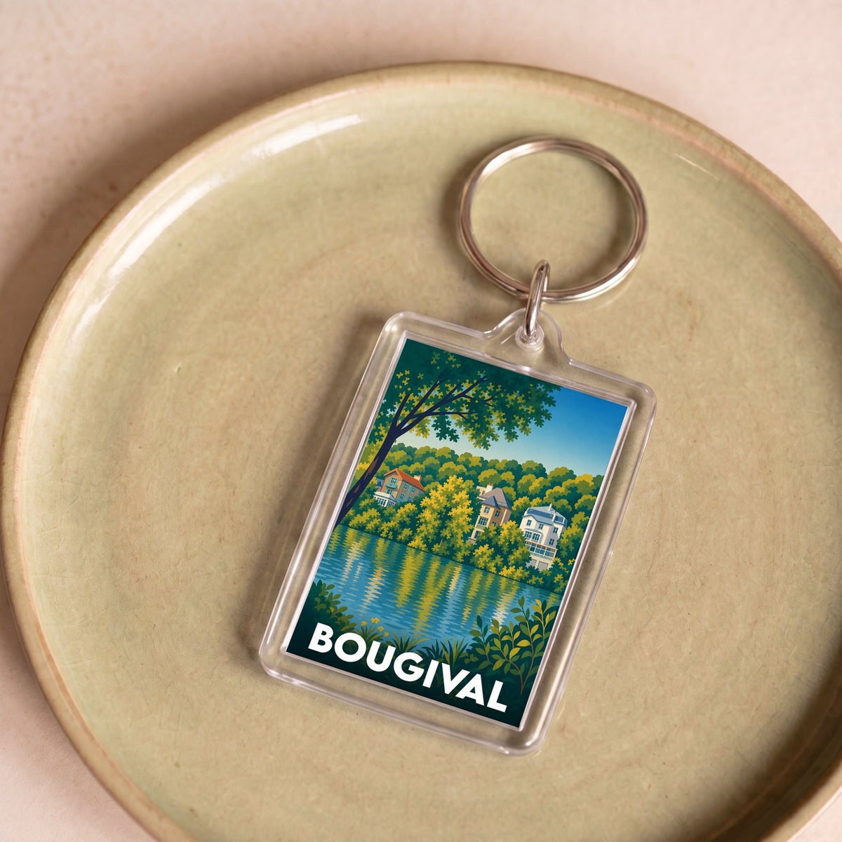 Porte-clés souvenir de la ville de Bougival avec une illustration colorée et stylisée des bords de Seine.