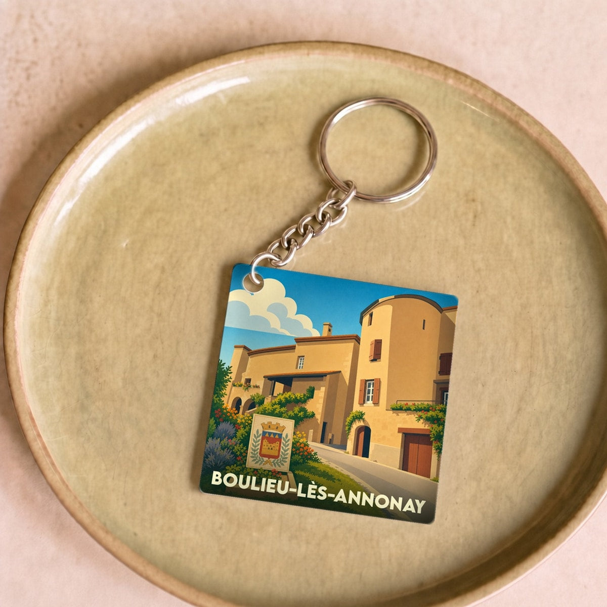 Porte-clés souvenir de la ville de Boulieu-lès-Annonay avec une illustration stylisée.