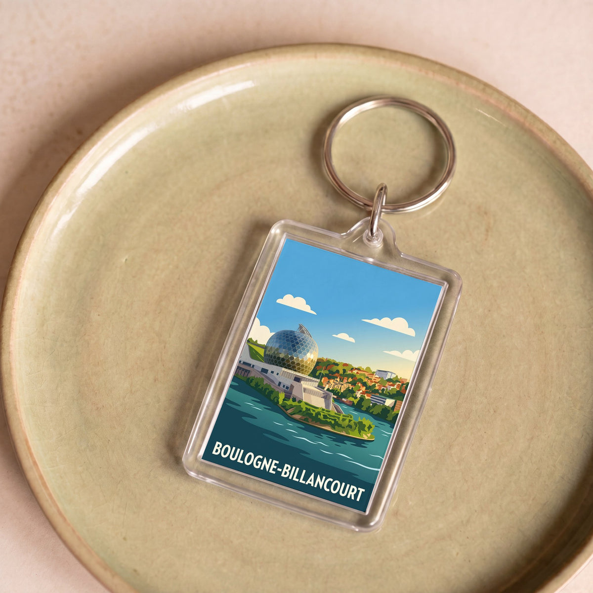 Porte-clés souvenir de la ville de Boulogne-Billancourt avec une illustration stylisée.