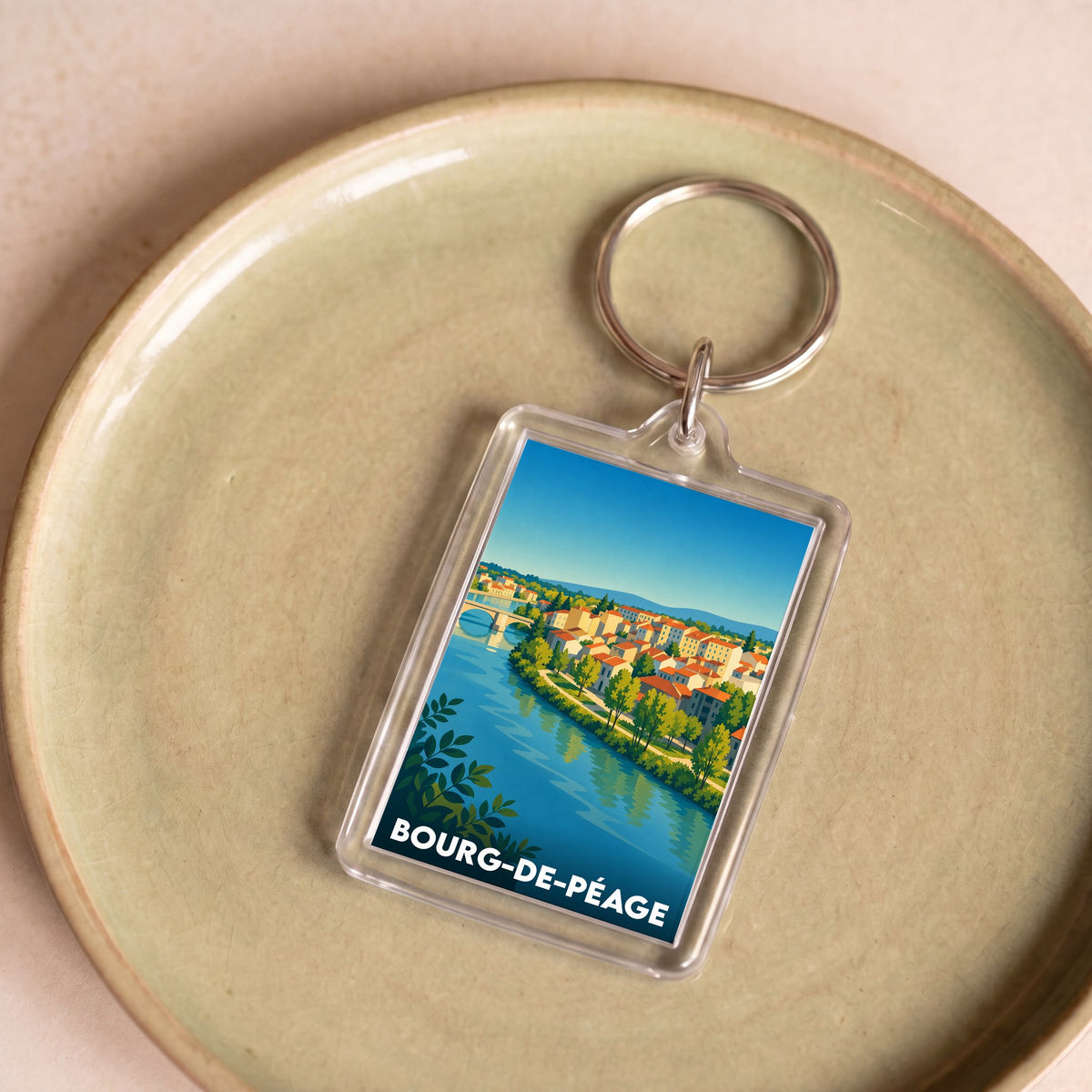 Porte-clés souvenir de la ville de Bourg-de-Péage avec une illustration colorée et stylisée.