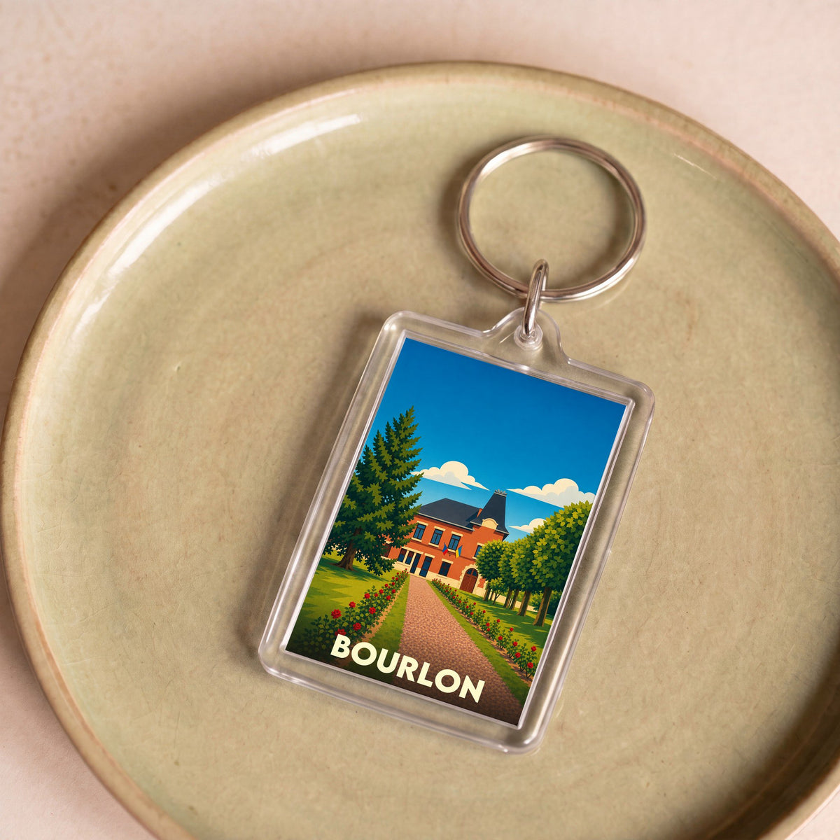 Porte-clés souvenir de la ville de Bourlon avec une illustration stylisée.
