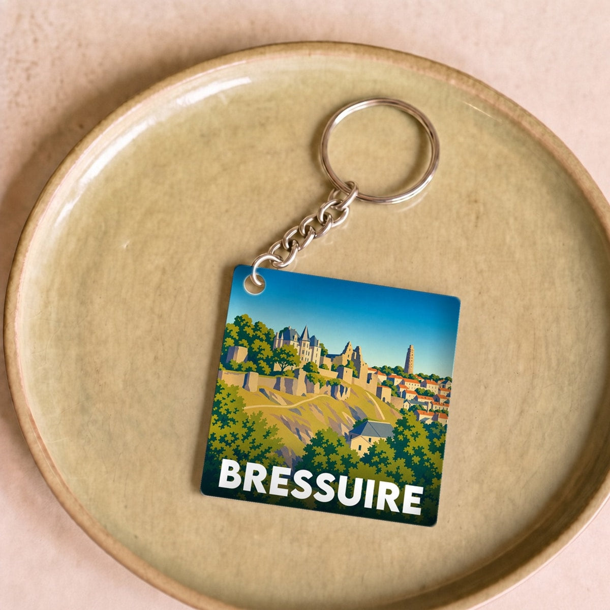 Porte-clés souvenir de la ville de Bressuire avec une illustration stylisée.
