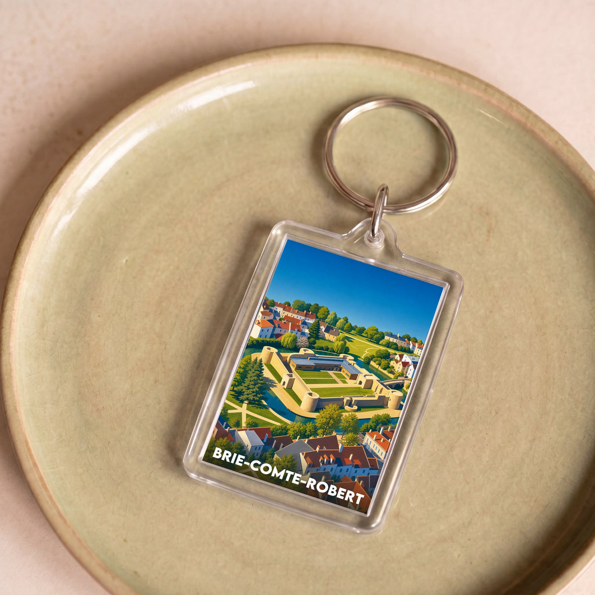 Porte-clés souvenir de la ville de Brie-Comte-Robert avec une illustration stylisée.