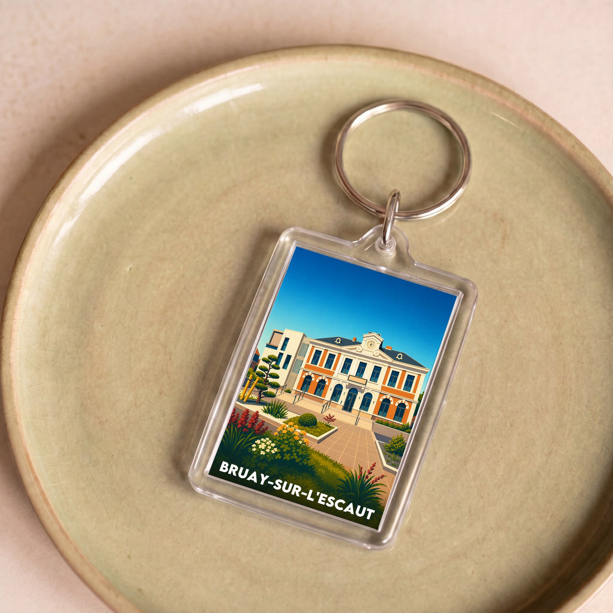 Porte-clés souvenir de la ville de Bruay-sur-l'Escaut avec une illustration stylisée.