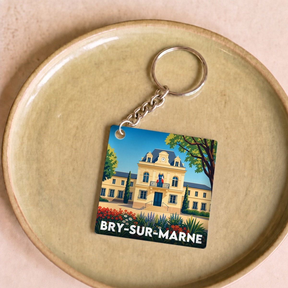 Porte-clés souvenir de la ville de Bry-sur-Marne avec une illustration stylisée.