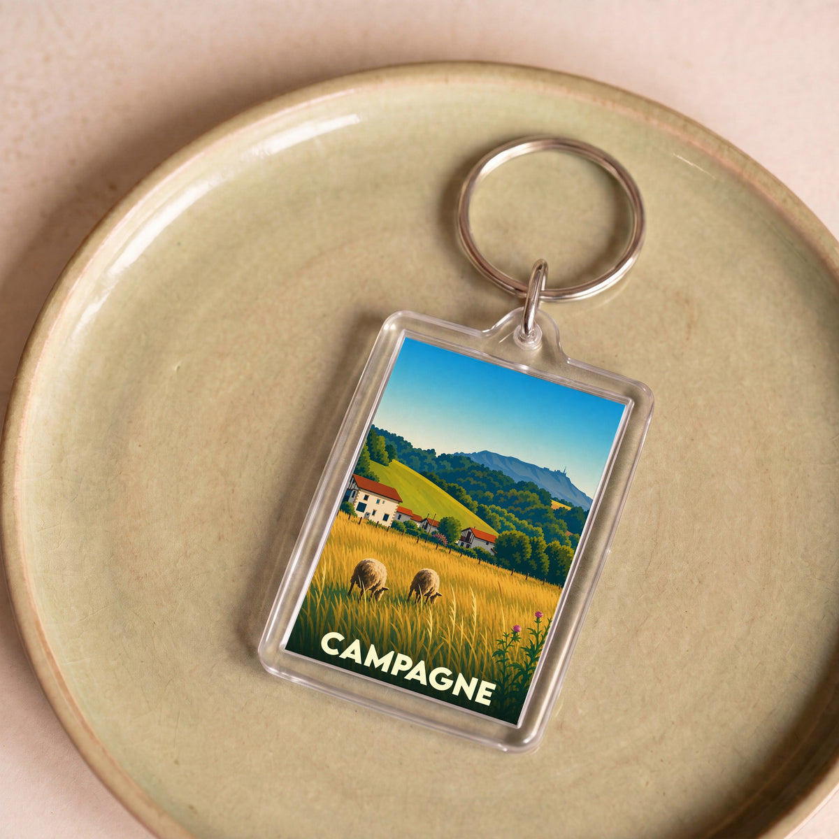 Porte-clés souvenir de la ville de Campagne avec une illustration stylisée.