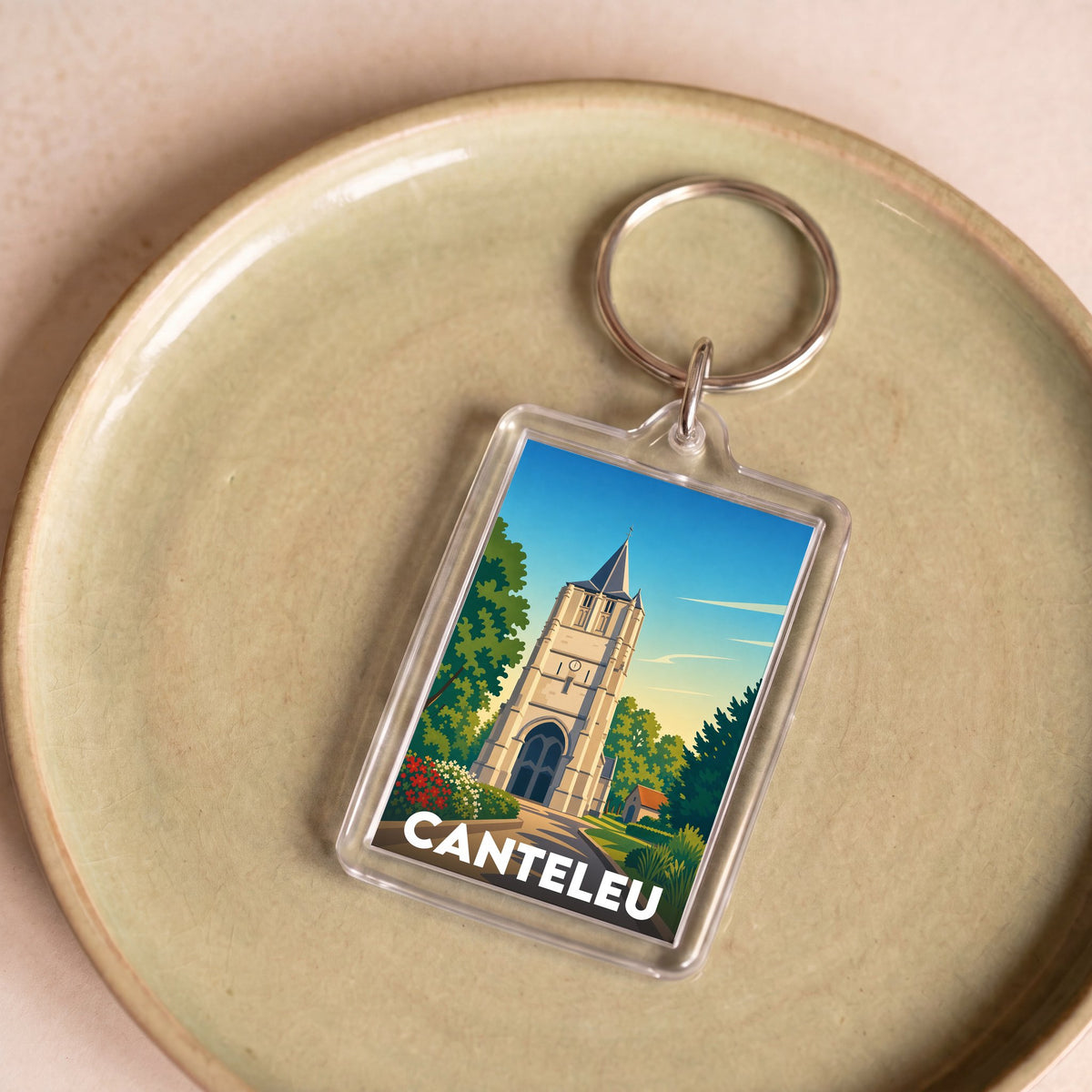 Porte-clés souvenir de la ville de Canteleu avec une illustration stylisée de son église.