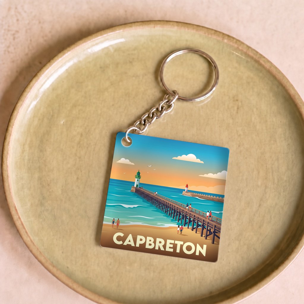 Porte-clés souvenir de la ville de Capbreton avec une illustration stylisée de sa jetée.