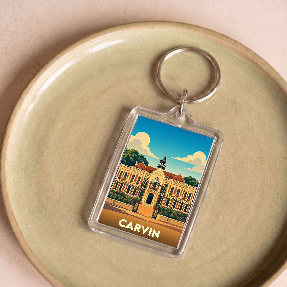 Porte-clés souvenir de la ville de Carvin avec une illustration stylisée de son hôtel de ville.