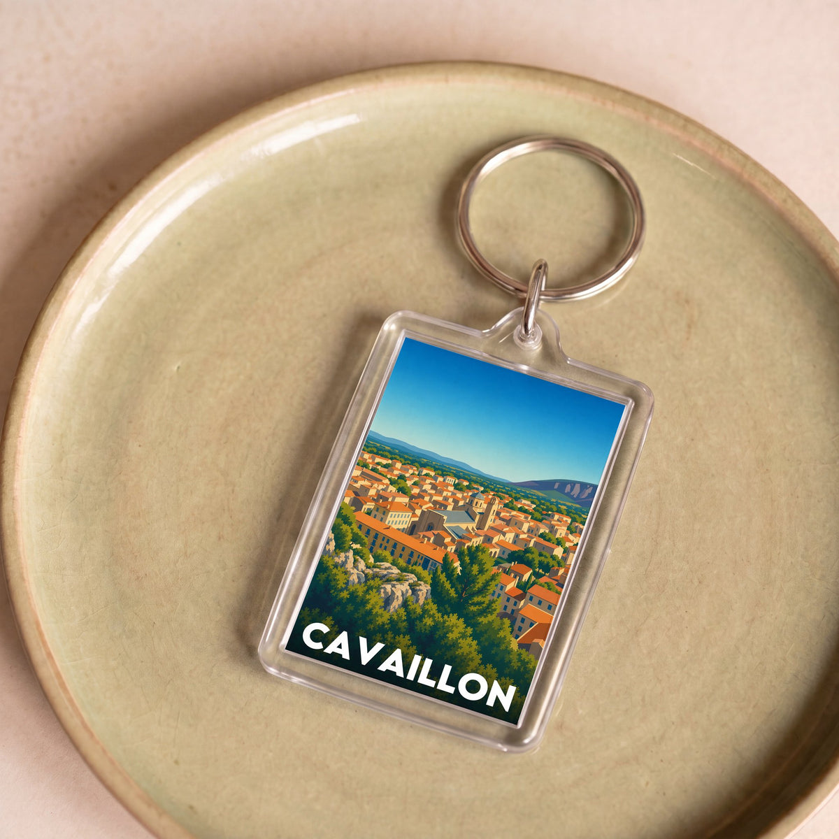Porte-clés souvenir de la ville de Cavaillon avec une illustration stylisée.
