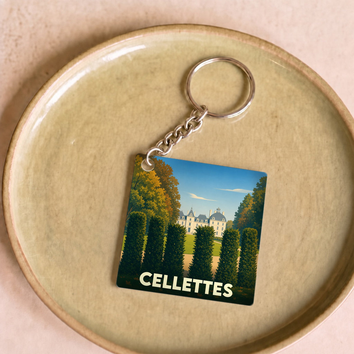 Porte-clés souvenir de la ville de Cellettes avec une illustration stylisée d'un château.