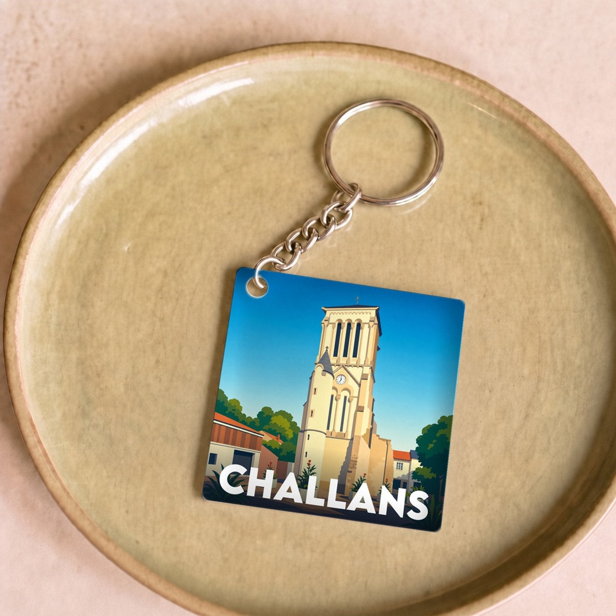 Porte-clés souvenir de la ville de Challans avec une illustration stylisée.