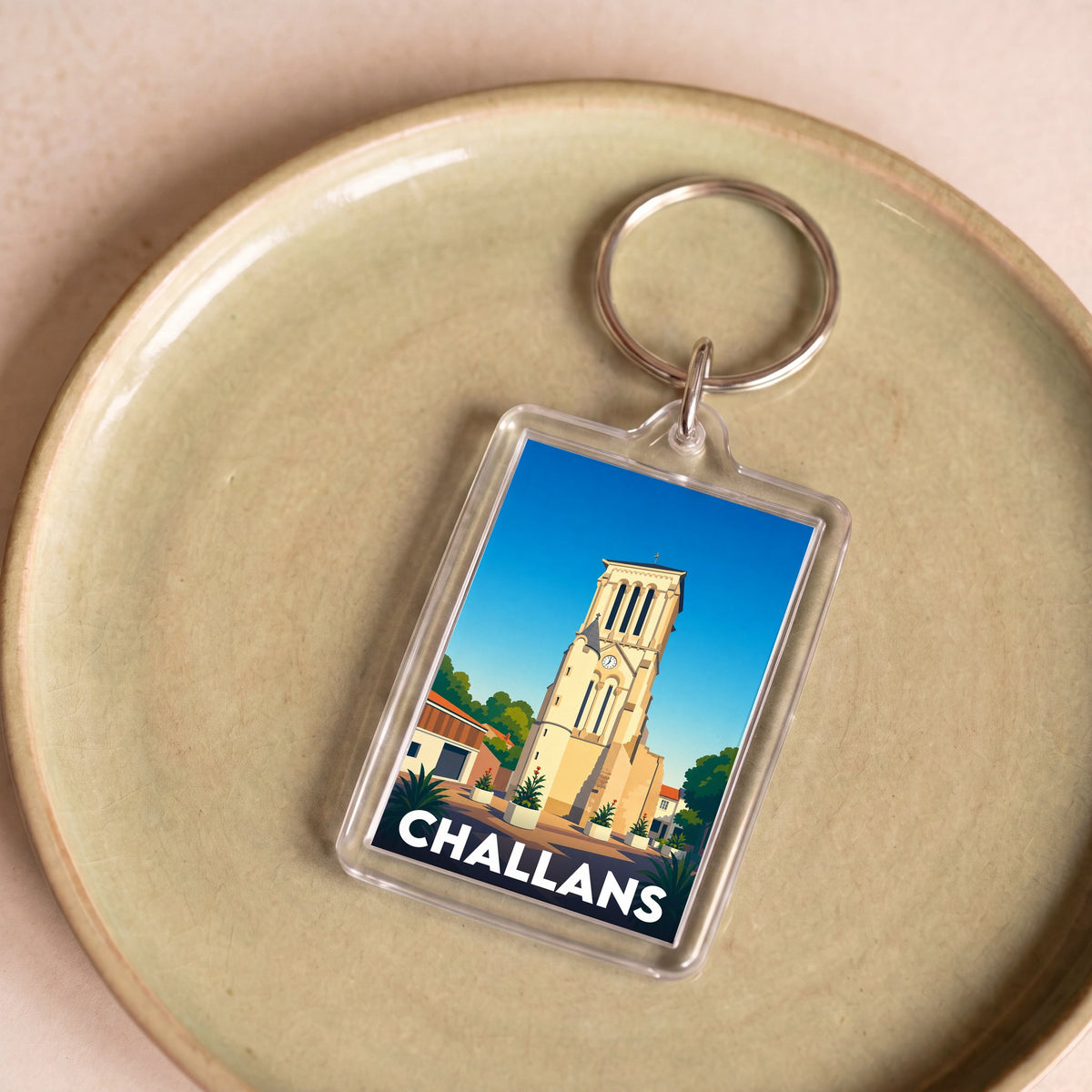 Porte-clés souvenir de la ville de Challans avec une illustration stylisée.