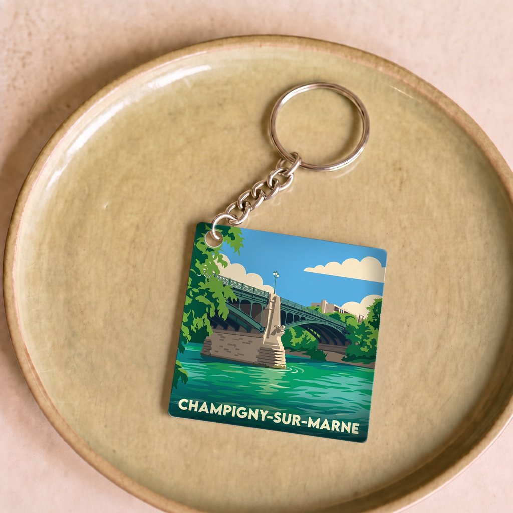 Porte-clés souvenir de la ville de Champigny-sur-Marne avec une illustration stylisée.
