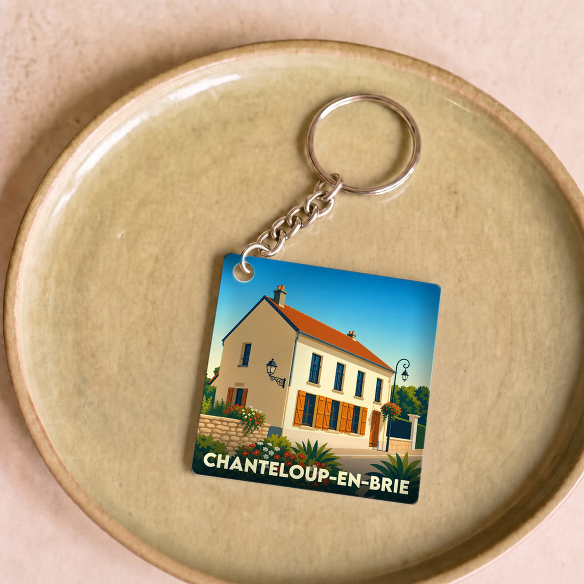 Porte-clés souvenir de la ville de Chanteloup-en-Brie avec une illustration stylisée.