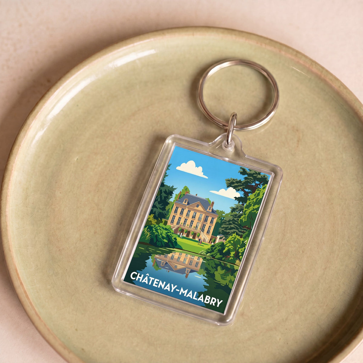 Porte-clés souvenir de la ville de Châtenay-Malabry avec une illustration stylisée.