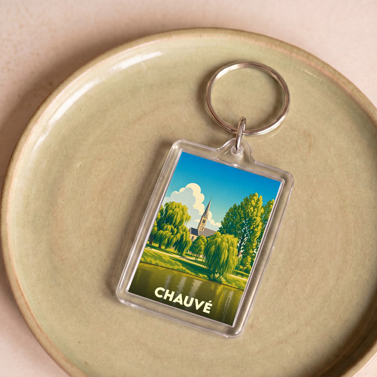 Porte-clés souvenir de la ville de Chauvé avec une illustration stylisée.