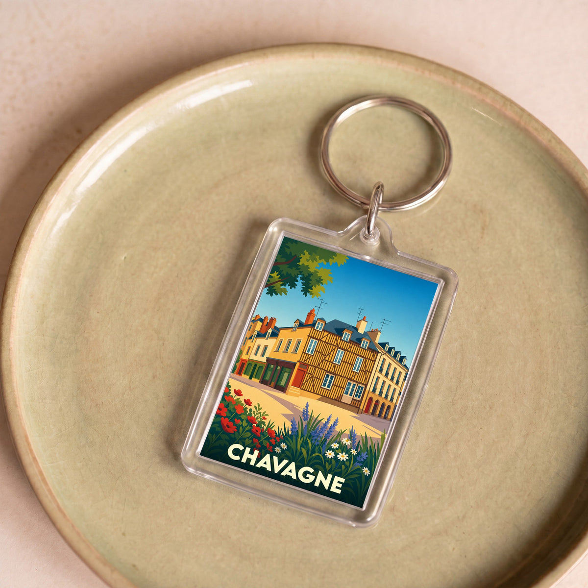 Porte-clés souvenir de la ville de Chavagne avec une illustration stylisée.