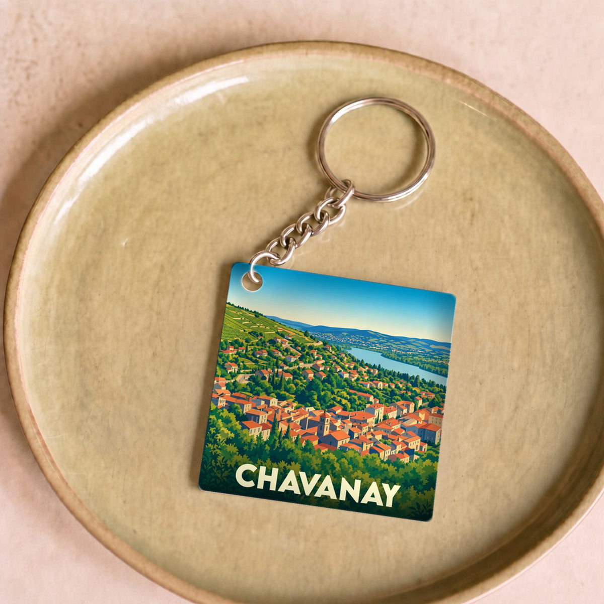 Porte-clés souvenir de la ville de Chavanay avec une illustration stylisée de ses toits et du Rhône.