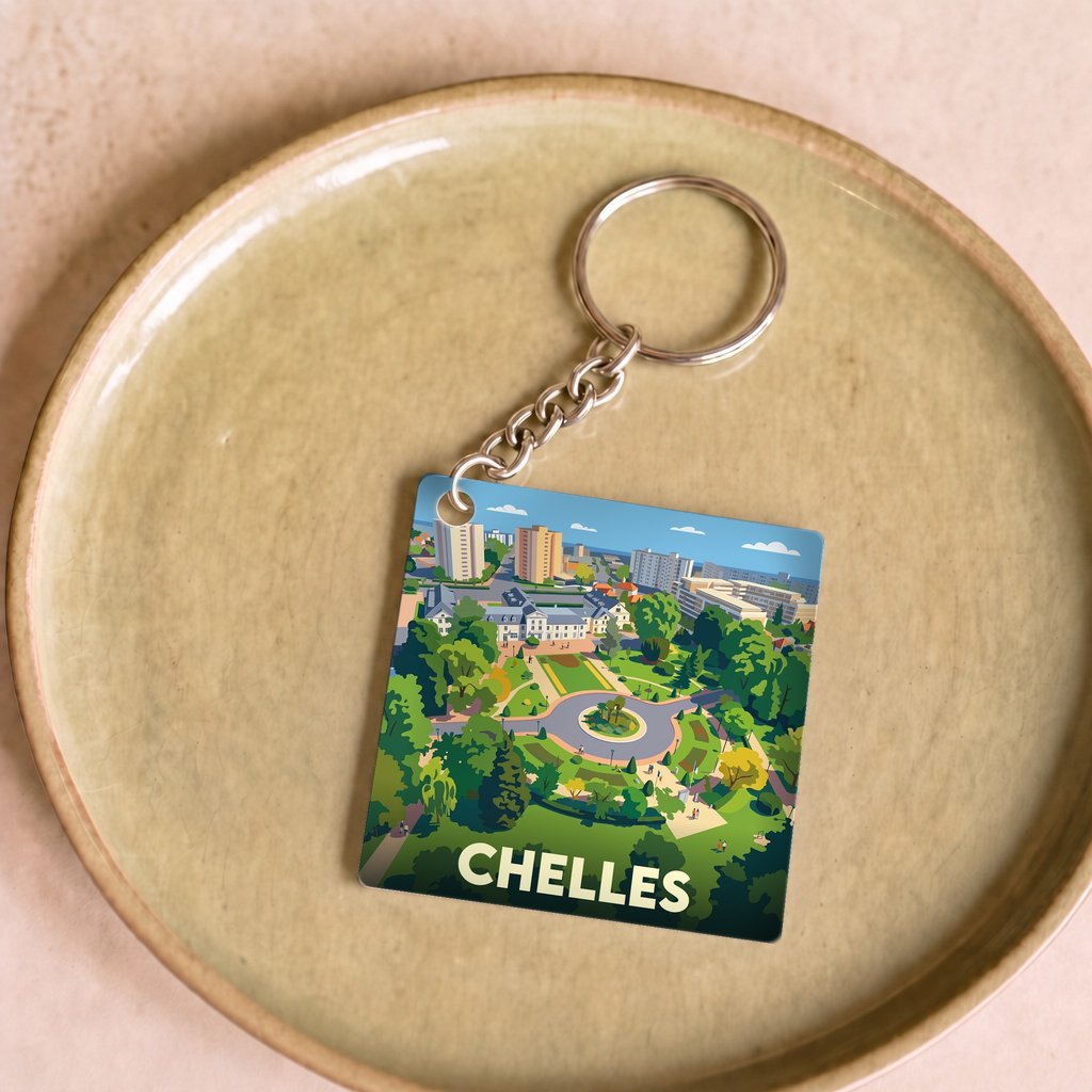 Porte-clés souvenir de la ville de Chelles avec une illustration stylisée.