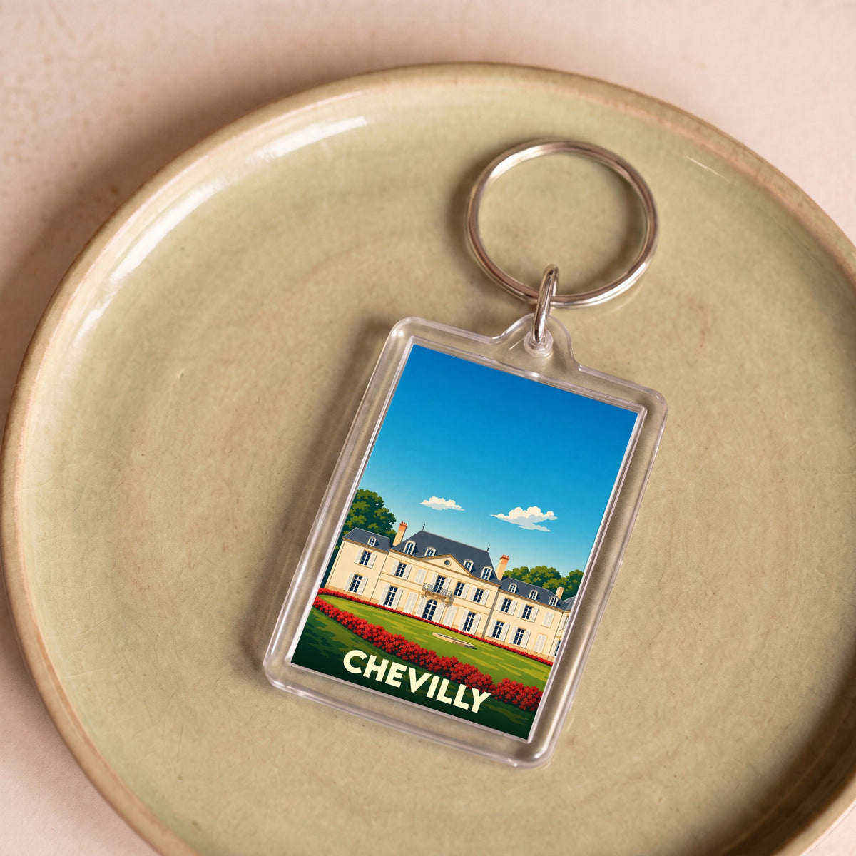 Porte-clés souvenir de la ville de Chevilly avec une illustration stylisée de son château.