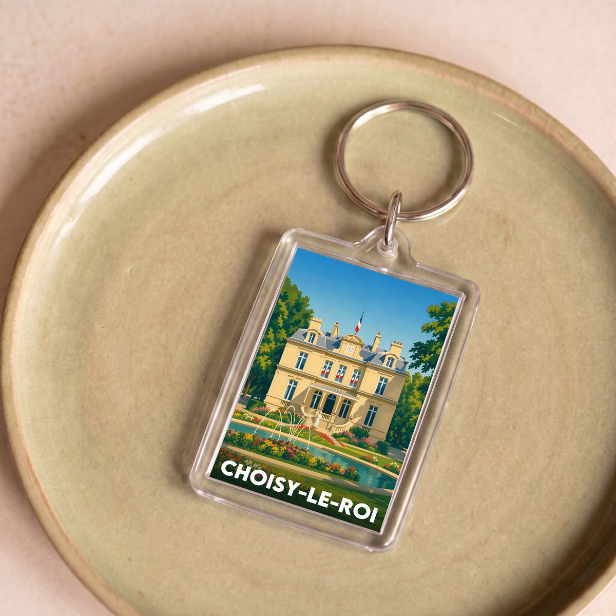 Porte-clés souvenir de la ville de Choisy-le-Roi avec une illustration stylisée.