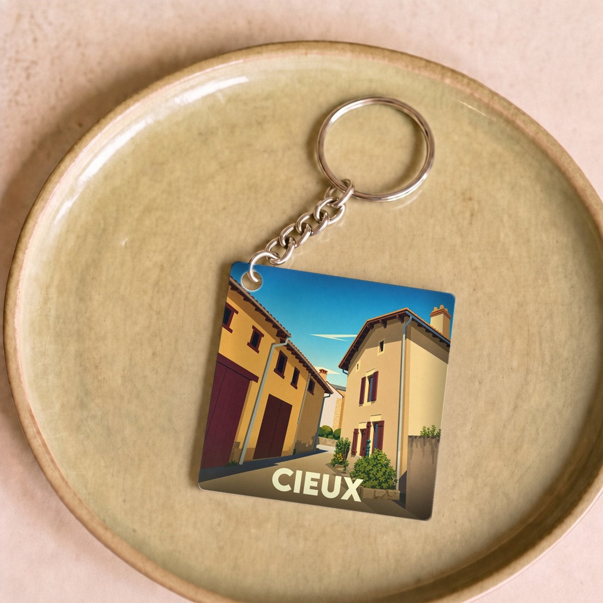 Porte-clés souvenir de la ville de Cieux avec une illustration stylisée.