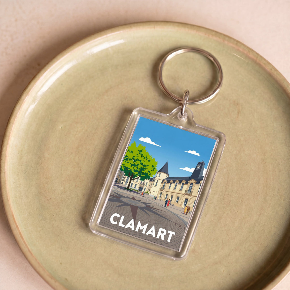 Porte-clés souvenir de la ville de Clamart avec une illustration stylisée.